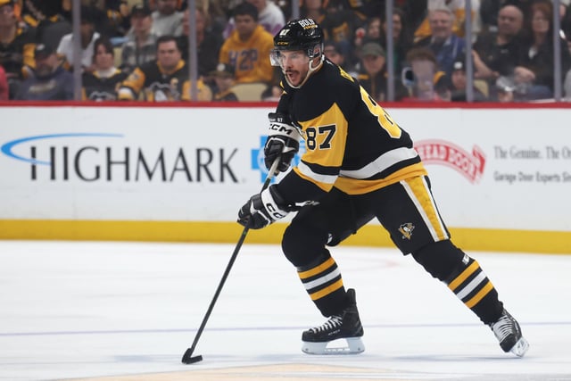 Apr 13, 2025; Pittsburgh, Pennsylvania, USA;  Pittsburgh Penguins center Sidney Crosby (87) handles the puck against the Boston Bruins during the third period at PPG Paints Arena. Mandatory Credit: Charles LeClaire-Imagn Images/File Photo