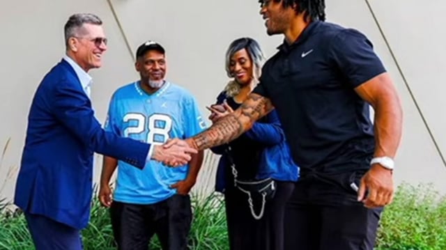 Jim Harbaugh meets Omarion Hampton.