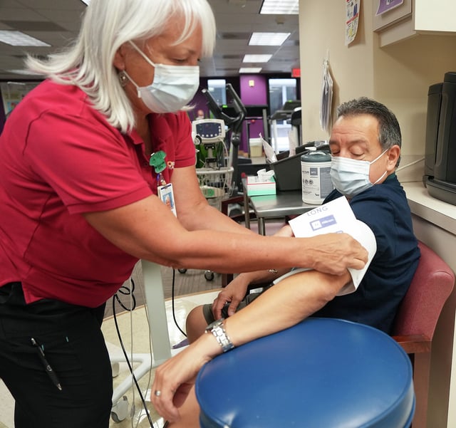 Registered nurse Patricia Weihs takes John Longoria’s vitals during his visit in 2023. May 6-12 is National Nurses Week. 