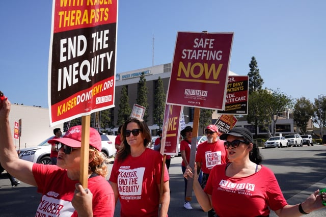 Members from the National Union of Healthcare Workers (NUHW) demonstrated out in front to the entrance to the Kaiser Administration Office and not far from Kaiser Hospital on Tuesday, March 25, 2025, in San Diego, CA. Union members have been out without a contract for almost 6 months. (Nelvin C. Cepeda / The San Diego Union-Tribune)