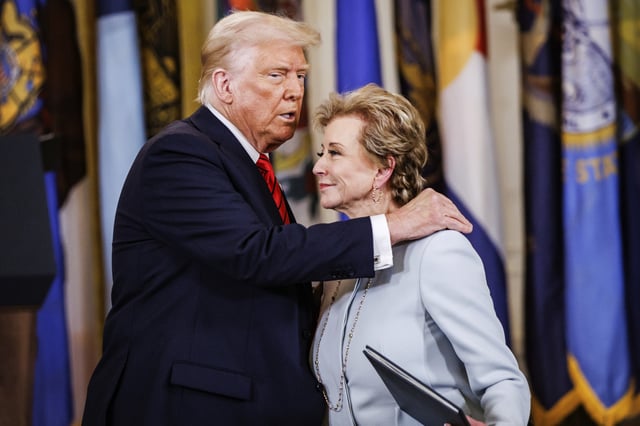 President Donald Trump hugs Education Secretary Linda McMahon after handing her the executive order to dismantle the Department of Education he just signed with during an event in the East Room of the White House in Washington, D.C. on March 20, 2025.