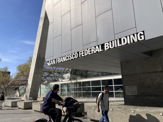 Pedestrians pass the San Francisco Federal building on on 7th Street in San Francisco on April 27, 2023. | RJ Mickelson/The Standard