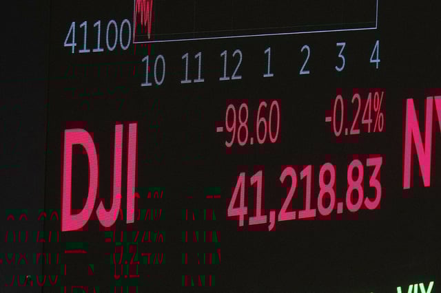 A board above the trading floor of the New York Stock Exchange displays the closing number for the Dow Jones industrial average, Monday, May 5, 2025. (AP Photo/Richard Drew)
