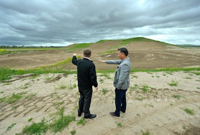 Irvine Councilman Mike Carroll, left, and Sean Crumby, assistant city manager, talk about an amphitheater planed for the Great Park as they stand on a hill overlooking the site in Irvine, CA, on Monday, May 5, 2025. (Photo by Jeff Gritchen, Orange County Register/SCNG)