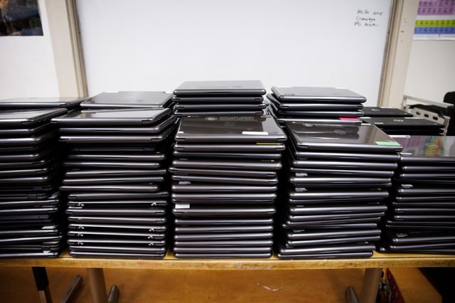 A pile of Chromebooks with expired software sit in a classroom at Montera Middle School in Oakland, Calif., on Tuesday, June 27, 2023. (Dai Sugano/Bay Area News Group)