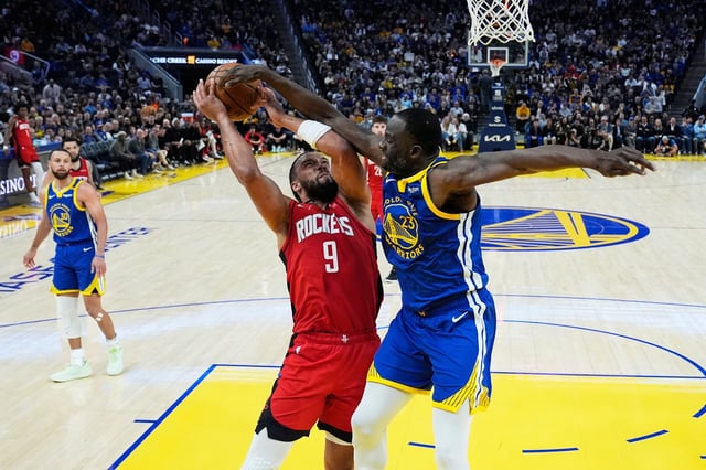 Golden State Warriors forward Draymond Green commits a foul on Houston Rockets forward Dillon Brooks during a game on Sunday, April 6, 2025, at Chase Center in San Francisco.