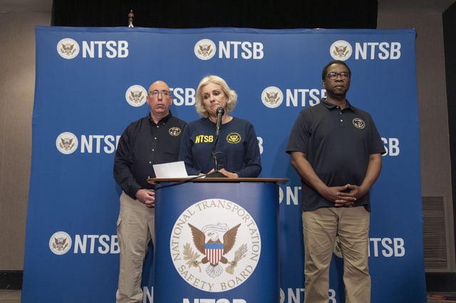 FILE - National Transportation Safety Board Chair Jennifer Homendy, center, pauses while speaking accompanied by NTSB Investigator in Charge, Marcel Muise, left, and NTSB board member Alvin Brown, during a news conference, March 27, 2024, in Linthicum Heights, Md. (AP Photo/Alex Brandon, File)