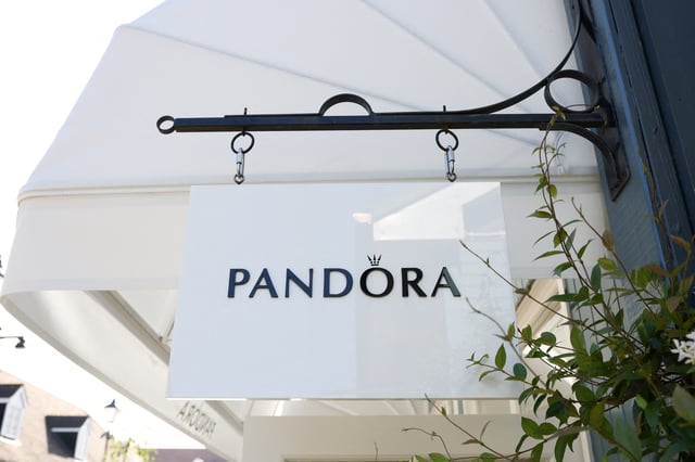A logo is displayed on a sign at the Pandora outlet retail store at Bicester Village in Oxfordshire, Britain, August 21, 2024. REUTERS/Hollie Adams/File Photo
