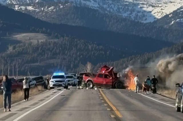 Rescue workers arrive to the scene after a deadly collision between a pickup truck and tour van near Henry’s Lake State Park in eastern Idaho on Thursday, May 1, 2025.   (Roger Merrill via AP)