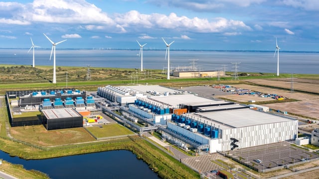 Wind turbines spin near our Eemshaven, Netherlands, data center.