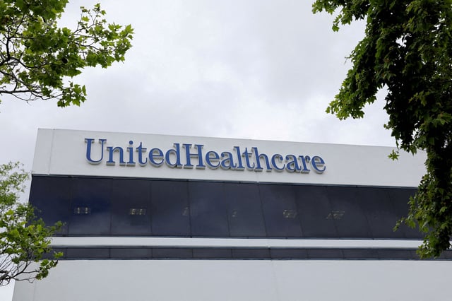 The corporate logo of the UnitedHealth Group appears on the side of one of their office buildings in Santa Ana, California, U.S., April 13, 2020.      REUTERS/Mike Blake///File Photo/File Photo/File Photo