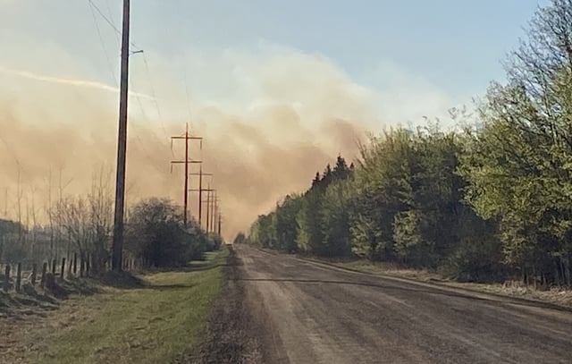 Smoke from a wildfire is seen near Redwater, Alta., on May 7, 2025.
