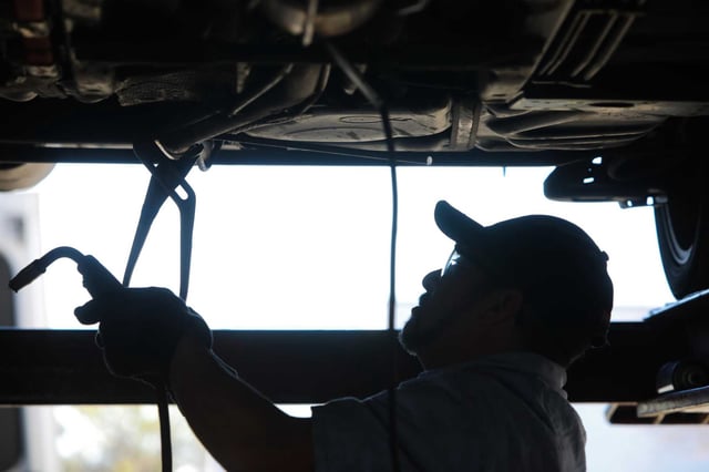 Alberto Pachuca, a mechanic, builds a protective cage for a catalytic converter in a Toyota Prius at Johnny Franklin Muffler on January 24, 2021, in Santa Rosa. A Sacramento man was sentenced Tuesday to 12 years in federal prison for leading a sprawling $38 million operation trafficking in stolen catalytic converters, a scheme authorities say stretched from California to New Jersey and exploited thousands of car owners across the country.