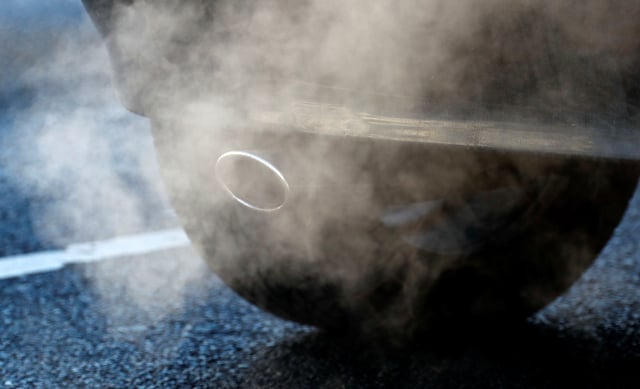 An exhaust pipe of a car is pictured on a street in a Berlin, Germany, February 22, 2018.  REUTERS/Fabrizio Bensch/File Photo