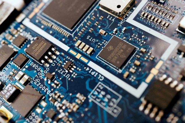 Semiconductor chips are seen on a circuit board of a computer on February 25, 2022.