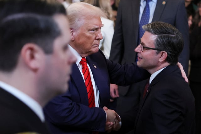 U.S. President Donald Trump shakes hands with Speaker of the House Mike Johnson in the East Room at the White House in Washington, U.S., February 5, 2025. REUTERS/Leah Millis/File Photo