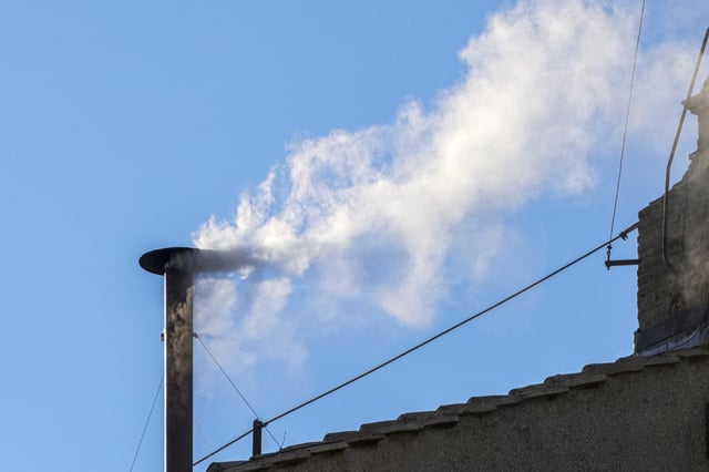 White smoke billows from the chimney of the Sistine Chapel during the conclave to elect a new pope, at the Vatican, Thursday, May 8, 2025.