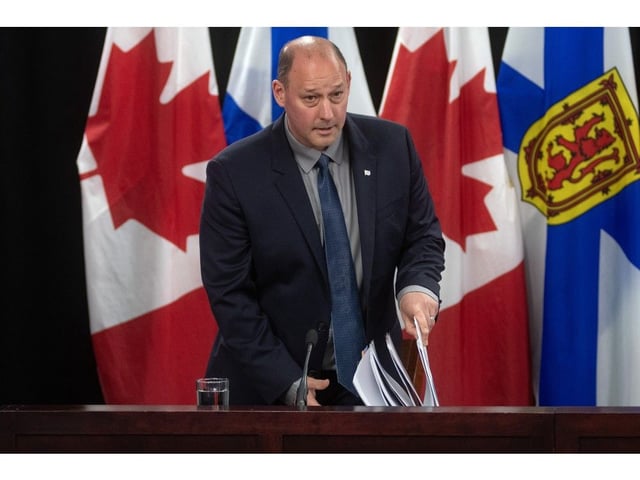  Environment Minister Tim Halman arrives for a news conference at One Government Place in Halifax on Thursday.