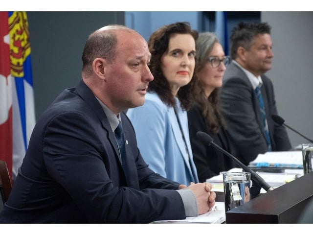  Environment Minister Tim Halman answers questions from reporters in Halifax on Thursday. The minister is accompanied by Lora MacEachern, deputy minister of the provincial department, Lynn Bowen, the department’s executive director of policy and environmental assessments, and Todd Burgess, executive director of Forest Nova Scotia.