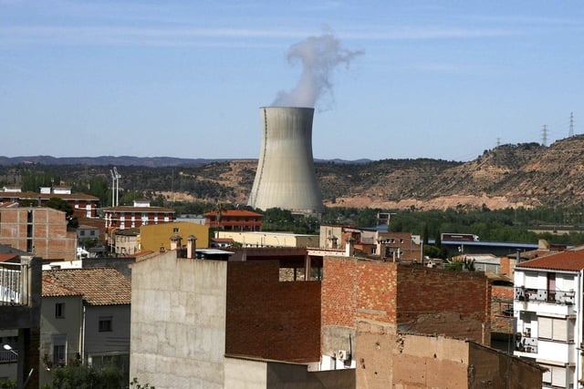 FILE - The Asco I nuclear power station, center, is seen near houses in the small town of Asco, Spain in Tuesday, April 15, 2008. (AP Photo/David Ramos, File)