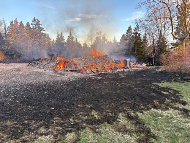 The second family home still smoldering in the after math of the fire