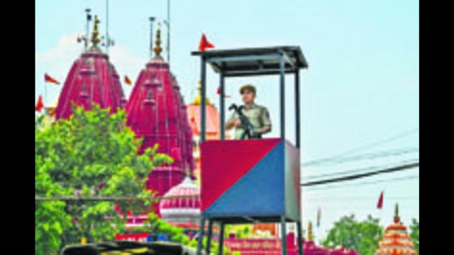 (Top) A police officer on a guard tower near the Red Fort. (RAJ K RAJ /HT PHOTO)