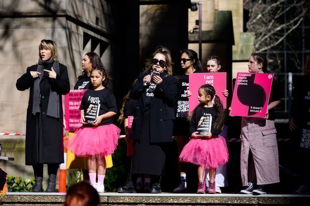 Organizers speak during a national rally against domestic violence in Sydney, Sunday, July 28, 2024. (AAP Image/Steve Markham) NO ARCHIVING