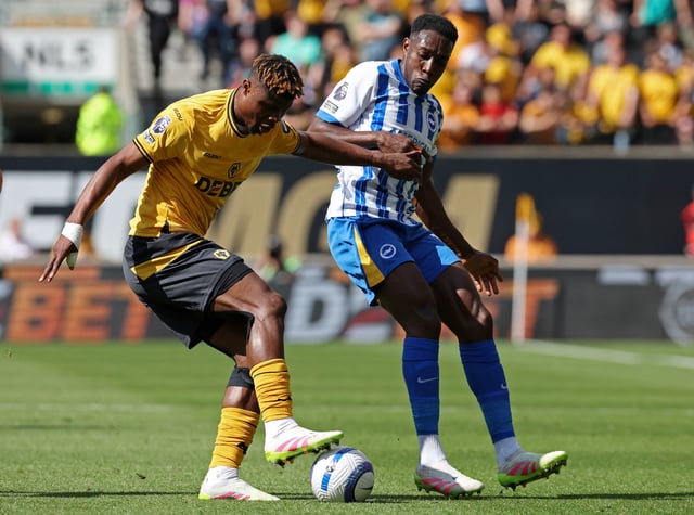 Soccer Football - Premier League - Wolverhampton Wanderers v Brighton & Hove Albion - Molineux Stadium, Wolverhampton, Britain - May 10, 2025 Wolverhampton Wanderers' Emmanuel Agbadou in action with Brighton & Hove Albion's Danny Welbeck REUTERS/Chris Radburn