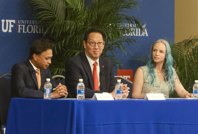 Santa Ono, center, is flanked by Rahul Patel and Sarah Lynne on Tuesday while attending a faculty forum at the University of Florida. Ono, the University of Michigan president, was tapped last week to lead Florida’s flagship university. (Tampa Bay Times)