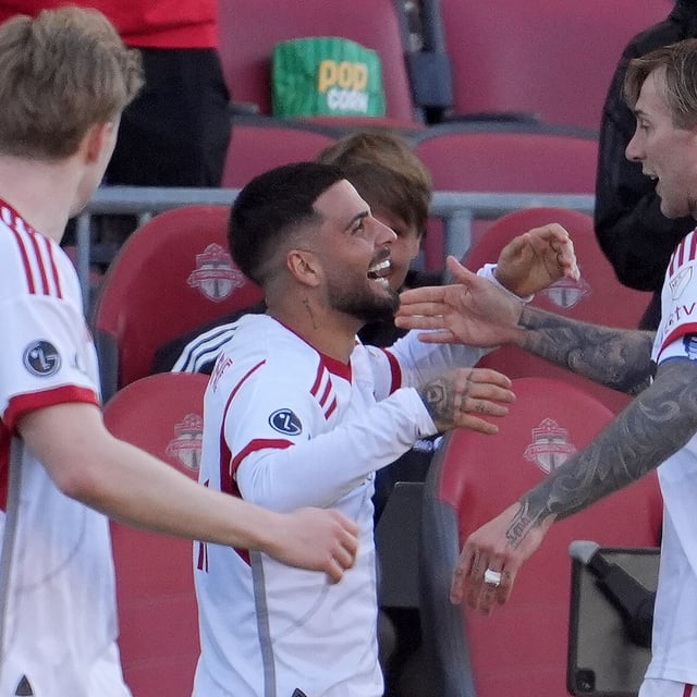 Toronto FC forward Lorenzo Insigne (24) celebrates his goal with teammate Federico Bernardeschi (10) during second half MLS soccer action against the D.C. United, in Toronto, Saturday, May 10, 2025. THE CANADIAN PRESS/Frank Gunn