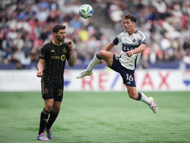  Vancouver Whitecaps’ Sebastian Berhalter, right, and Los Angeles FC’s Ryan Hollingshead vie for the ball during the second half on Sunday