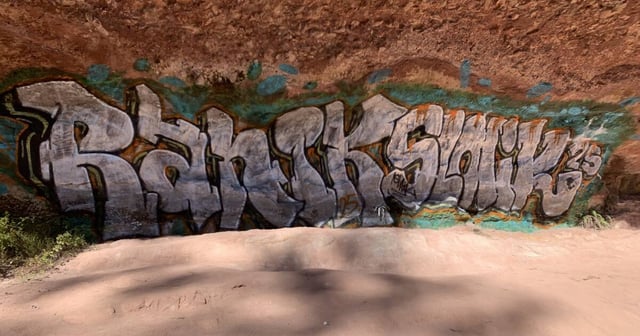 Police are trying to work out the graffiti vandal, or vandals, who defaced Paradise Falls in the King Valley. Images of the graffiti have been shared on social media. Picture supplied