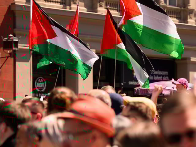 BASEL, SWITZERLAND - MAY 11: Protestors wave Palestinian flags during a demonstration against Israel's candidate at the Eurovision Song Contest 2025 Turquoise Carpet of the 69th Eurovision Song Contest Opening Ceremony at Messe Basel on May 11, 2025 in Basel, Switzerland. (Photo by Harold Cunningham/Getty Images)