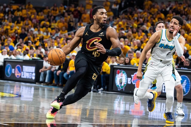 May 9, 2025; Indianapolis, Indiana, USA; Cleveland Cavaliers guard Donovan Mitchell (45) dribbles  the ball while Indiana Pacers guard Tyrese Haliburton (0) defends during game three of the second round for the 2025 NBA Playoffs at Gainbridge Fieldhouse. Mandatory Credit: Trevor Ruszkowski-Imagn Images/File Photo