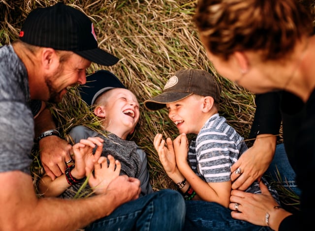 Jeremy and Bailey Koch with their two sons, Hudson and Asher, now age 18 and 16, at a younger age.