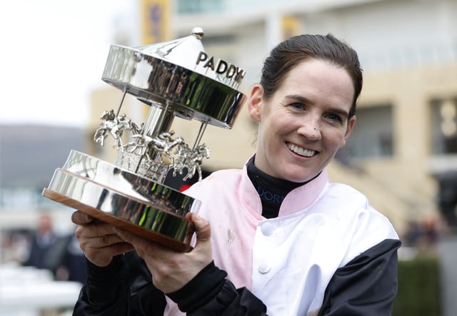 Horse Racing - Cheltenham Festival - Cheltenham Racecourse, Cheltenham, Britain - March 13, 2025 Rachael Blackmore riding Bob Olinger celebrates with the trophy after winning the 16:00 Paddy Power Stayers' Hurdle REUTERS/Peter Cziborra/File Photo