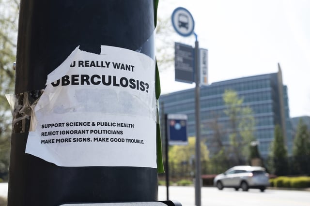 A sign about tuberculosis taped to a light pole across the street from the Centers for Disease Control and Prevention headquarters in Atlanta on Tuesday, April 1, 2025. THE CANADIAN PRESS/AP-Ben Gray