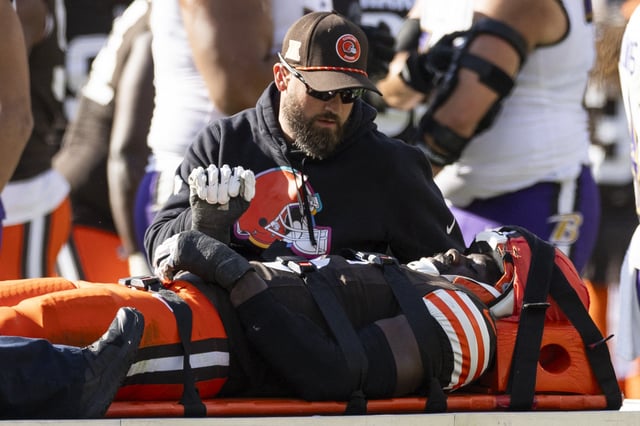 Oct 27, 2024; Cleveland, Ohio, USA; Cleveland Browns linebacker Jeremiah Owusu-Koramoah (6) lays on the medical cart after an injury during the third quarter against the Baltimore Ravens at Huntington Bank Field. Mandatory Credit: Scott Galvin-Imagn Images/File Photo