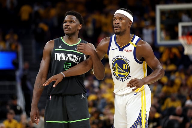 Anthony Edwards #5 of the Minnesota Timberwolves and Jimmy Butler III #10 of the Golden State Warriors look on during the fourth quarter in Game Three of the Western Conference Second Round NBA Playoffs at Chase Center on May 10, 2025 in San Francisco, California.