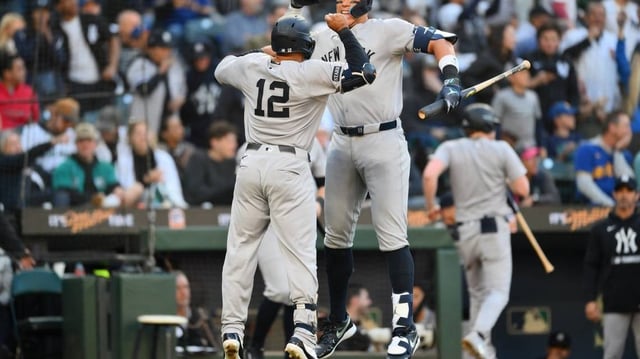 May 12, 2025; Seattle, Washington, USA; New York Yankees right fielder Aaron Judge (99) and center fielder Trent Grisham (12) celebrate after Grisham hit a home run against the Seattle Mariners during the third inning at T-Mobile Park. Mandatory Credit: Steven Bisig-Imagn Images