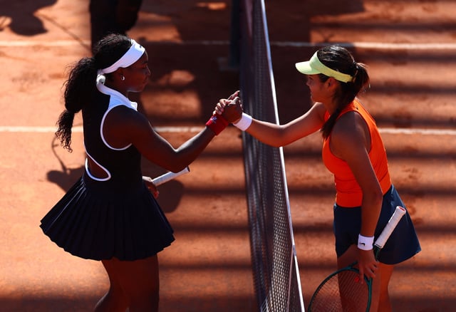 Tennis - Italian Open - Foro Italico, Rome, Italy - May 12, 2025 Britain's Emma Raducanu shakes hands with Coco Gauff of the U.S. after winning her round of 16 match REUTERS/Yves Herman