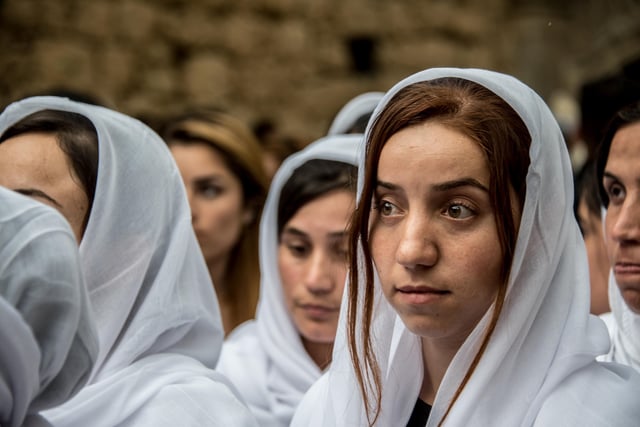 Survivors of the genocide perpetrated by ISIS that killed over 5,000 Yezidis in 2014. in Lalish, Iraqi Kurdistan Photo: Elizabeth Fitt / Alamy