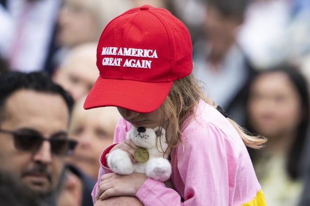 File photo: a young girl wears a &#34;Make America Great Again&#34; hat.
