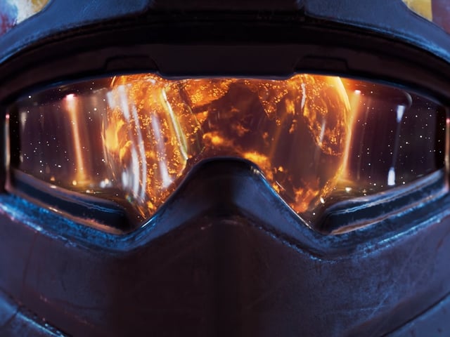 A Helldiver from Helldivers 2 seeing the ruination of Super Earth in the visor of their helmet.