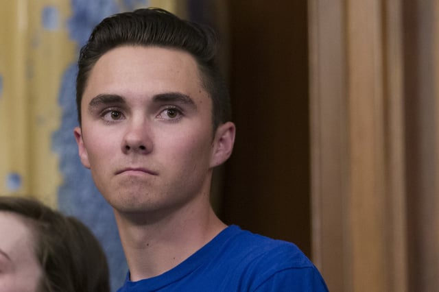 David Hogg, who survived the Stoneman Douglas High School shooting, stands during a news conference to announce the introduction of bipartisan legislation to expand background checks for sales and transfers of firearms, on Capitol Hill, Tuesday, Jan. 8, 2019 in Washington.