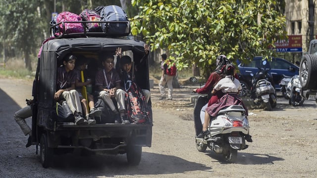 Students return home from school after normal activities resumed following a bilateral understanding between India and Pakistan, in Jalandhar, Punjab. 