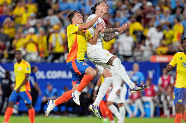 Jul 10, 2024; Charlotte, NC, USA;  Columbia midfielder Santiago Arias (4) and Uruguay forward Darwin Nunez (19) go up for a header during the second half at the Copa Armerica semi-final match at Bank of America Stadium. Mandatory Credit: Jim Dedmon-USA TODAY/File Photo