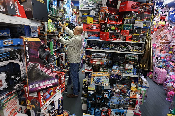 Hezzi Ramim works in his A to Z Toys store earlier this month in Miami Beach, Florida.  Ramim, who opened the store 39 years ago, said he would have to raise prices on almost all the toys in his store because of the Trump administration&#39;s tariffs on countries he imports toys from. (JOE RAEDLE/GETTY IMAGES)