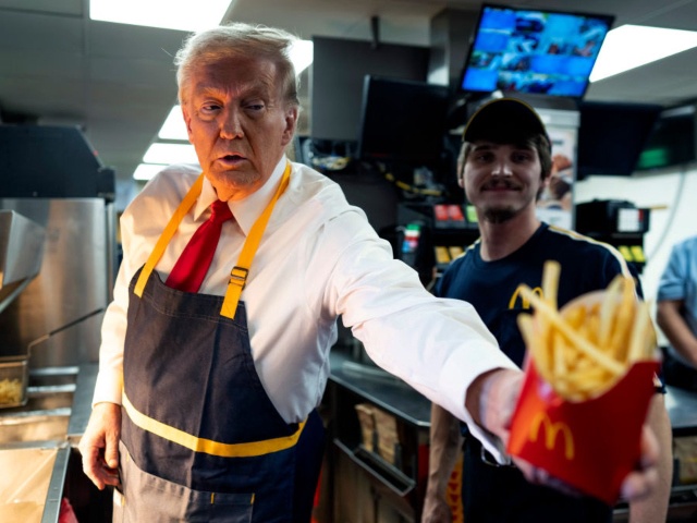 Former President Donald Trump as he works behind the counter during a visit to McDonalds in Feasterville-Trevose, PA, Sunday, Oct. 20, 2024.  (POOL Photo by Doug Mills/The New York Times