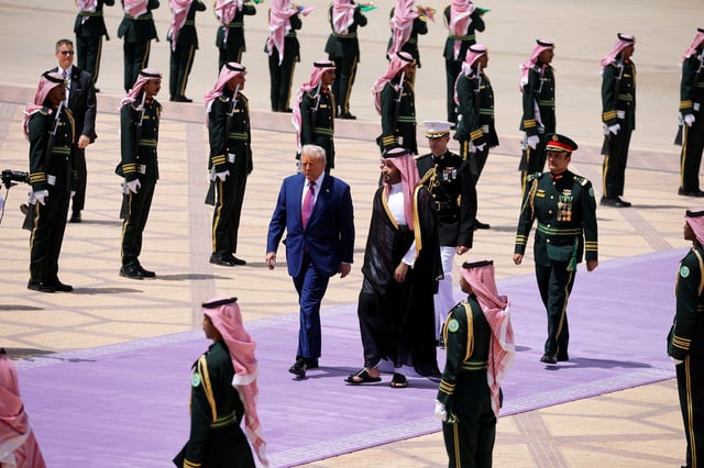 President Donald Trump and Saudi Crown Prince Mohammed Bin Salman walk as he arrives at King Khalid International Airport in Riyadh, Saudi Arabia, on May 13.